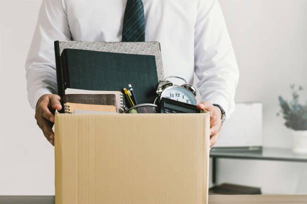 Resignation. businessmen holding boxes for personal belongings and resignation letters.Quitting a job,The big quit.The great Resignation.