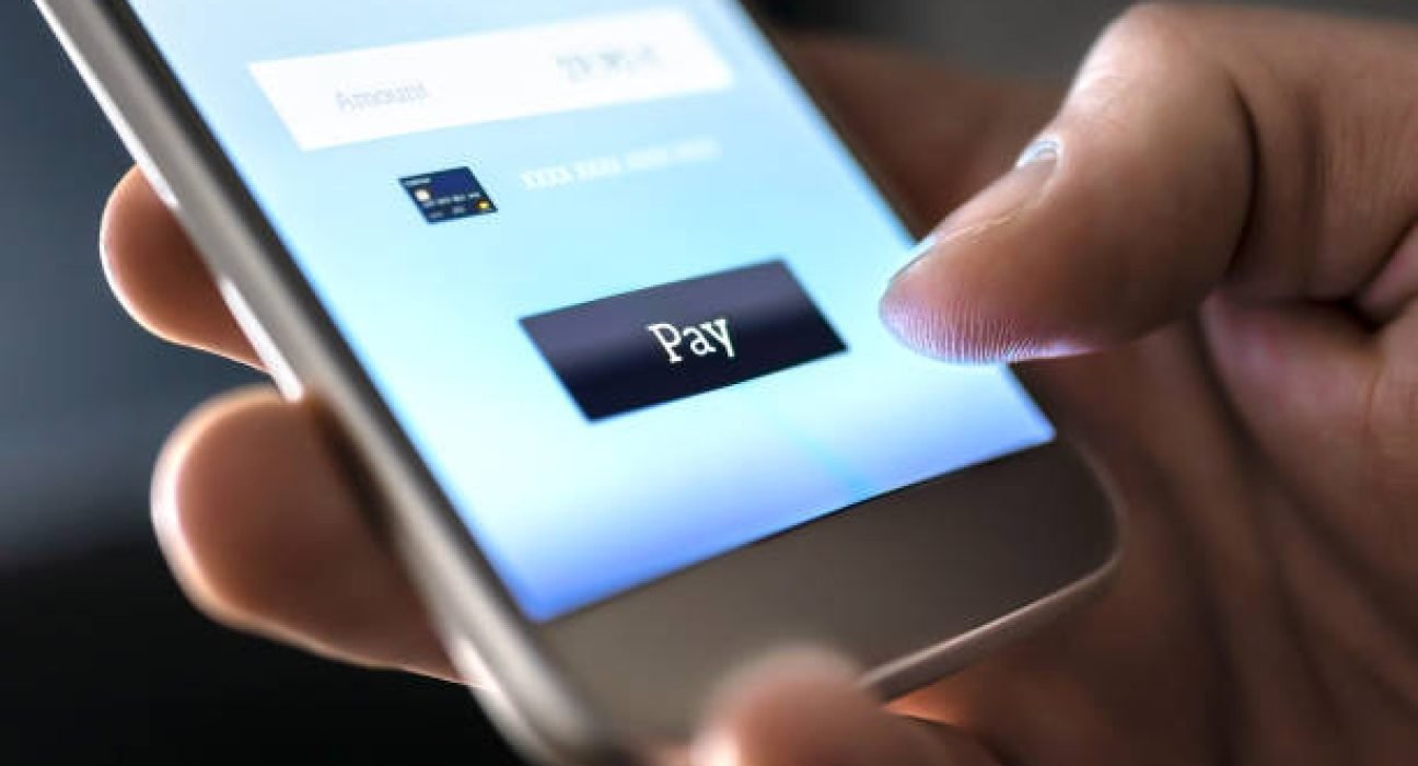 Mobile payment with wallet app and wireless nfc technology. Man paying and shopping with smartphone application and credit card information. Digital money transfer, banking and e commerce concept.